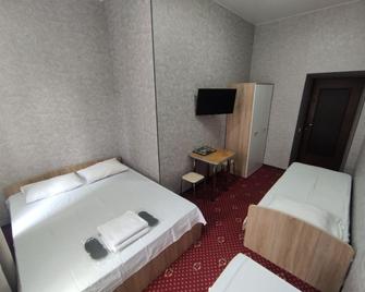 GeoRus mini Hotel - Krasnodar - Schlafzimmer