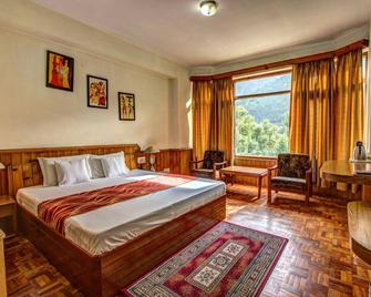 Khushboo Resorts - 馬納里 - 臥室