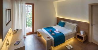 Hotel Adria - ליניאנו סביאדורו - חדר שינה