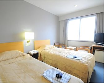 Hotel Tokachi Inn - Obihiro - Bedroom