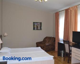Mini-Hotel Under The Roof - Lemberg - Schlafzimmer