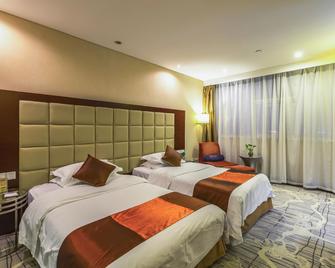 Detan Hotel - Changzhou - Schlafzimmer