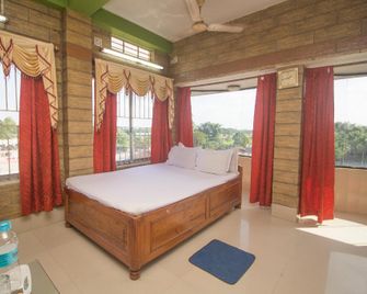 Hotel O Kanchanjanga Tourist Lodge - Alīpur Duār - Bedroom