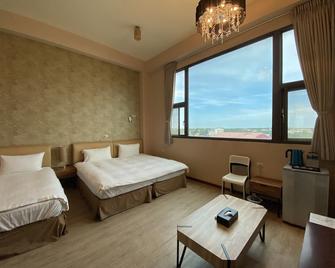 In99 Hotel - Jincheng Township - Schlafzimmer