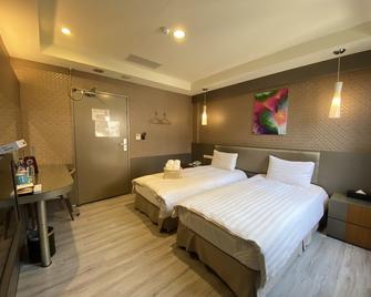 In99 Hotel - Jincheng Township - Schlafzimmer