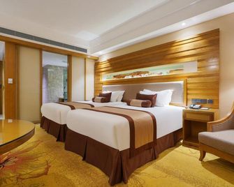 وانيي ليجينغ هوتل جويانج هواشي بارك - قوييانغ - غرفة نوم