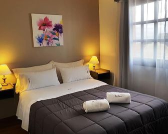 Hostal Malvinas - אושואיה - חדר שינה