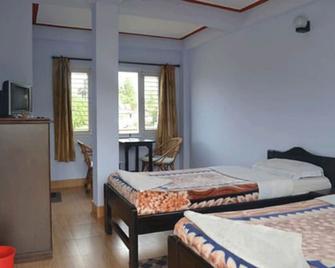 Nanohana Lodge - Pokhara - Schlafzimmer
