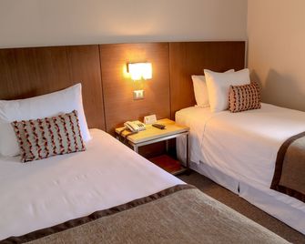 Hotel Martin Gusinde - פוארטו נטאלס - חדר שינה