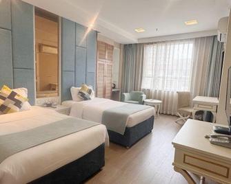 Jinye Jingsheng Hotel (Leshan High-speed Railway Station Jiaxing Road Food Street) - Leshan - Slaapkamer
