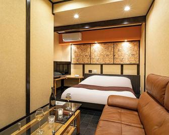Hotel Rakuseki Honkan - Toyooka - Ložnice