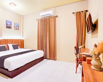 Collection O De Orchids Hotel Near Transmart Padang - Padang - Schlafzimmer