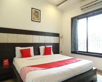 OYO 890 Seven Suites Apartment - Nagpur - Bedroom