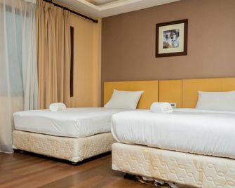 Scenic 2BR at Grand Setiabudi Apartment By Travelio - Bandung - Habitación