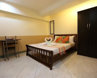 Roger's Place Hotel - باساي ستي - غرفة نوم