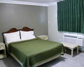 Deluxe Inn Motel - לייק צ'ארלס - חדר שינה