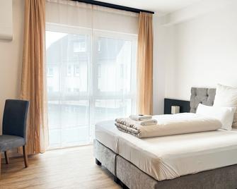 Qonroom - Detmold - Shared kitchen - Grill - App1 - Detmold - Bedroom