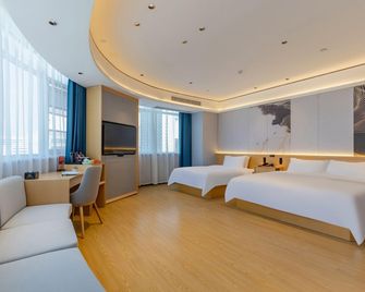 Gujing Junlai International Hotel (Bozhou University Baolong Plaza Branch) - Bozhou - Спальня