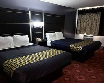 Coratel Inn & Suites by Jasper Hastings - Hastings - Schlafzimmer