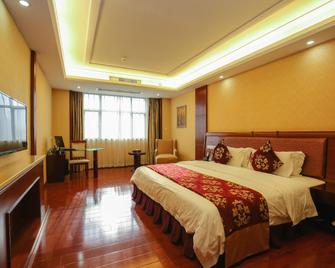 Xinghu Yipin Resort Hotel (Zhaoqing Railway Station) - Zhaoqing - Bedroom