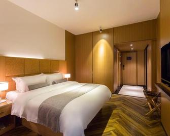Changsha Mellow Orange Hotel - Changsha - Bedroom