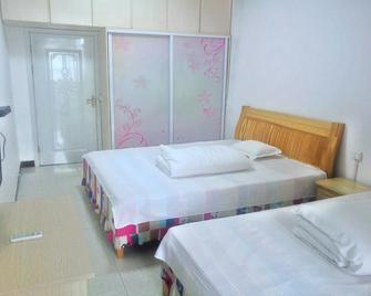 Weishan Lake Wanchun Inn - Zaozhuang - Bedroom