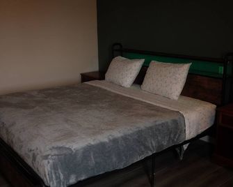 The Sage Hotel - Muscatine - Slaapkamer
