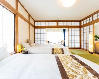A detached house with a relaxing view of the sea, - Minamiawaji - Bedroom