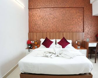 Hotel Palmyra Grand Inn - Cochín - Habitación