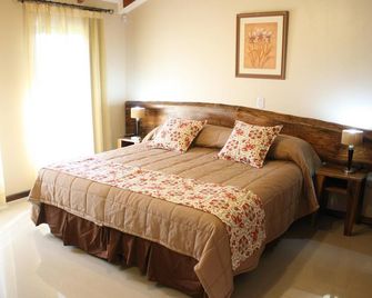 Posada del Jacaranda - بويرتو اجوازو - غرفة نوم