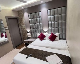 Hotel Abrol Suites - Mumbai - Schlafzimmer