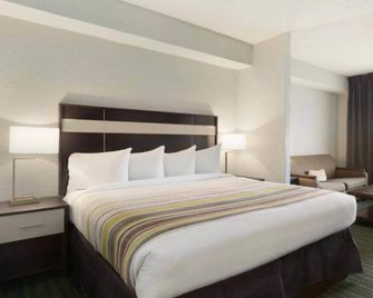 Hotel Flamingo Inn & Suites Vero Beach I-95 - Vero Beach - Ložnice