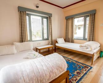 Hotel Mountain View - Lakeside Pokhara - פוחארה - חדר שינה