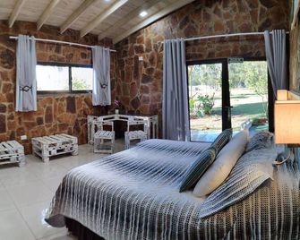 بوسادا 21 أورانجيز - بويرتو اجوازو - غرفة نوم