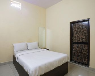 Hotel O Celebrity - Chandrapur - Habitación