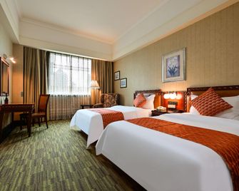 Zhongshan Sunshine Holiday Hotel (Zhongshan Pedestrian Street Xingzhong Plaza Store) - Zhongshan - Habitación