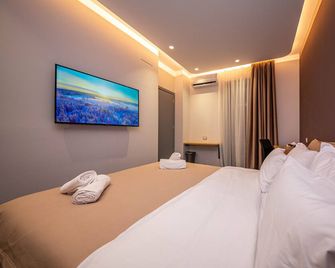 Blloku Unique Apartments - Tirana - Camera da letto