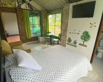 Cabaña en Parque Ecocenter - Santander - Habitación