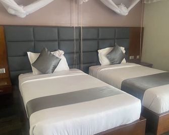 진나 스위트 리미티드 - 무코노 - 침실