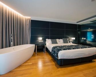 Hotel Inffinit - ויגו - חדר שינה