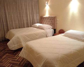 هوستال سويت أندينا - بونو - غرفة نوم