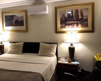 Mallika Company, Sl - Freetown - Bedroom