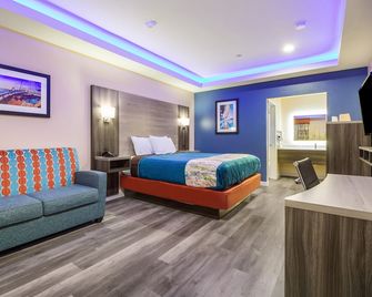 Scottish Inn & Suites Houston Willowbrook - Jersey Village - Ložnice