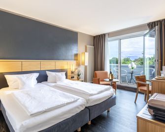 Plaza Inn Heidehof - Hermannsburg - Спальня