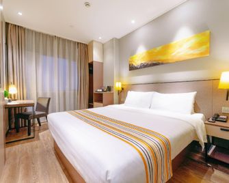 Home Inn Plus Ningbo Laowaitan Tianyi Square - Ningbo - Schlafzimmer