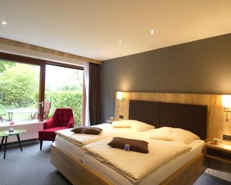 Akzent Hotel Cordes & Restaurant am Rosengarten - Rosengarten - Bedroom