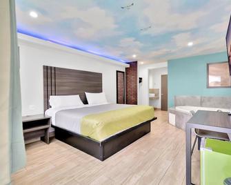 Exclusivo Inn and Suites - Lakewood - Bedroom