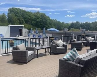 Inviting condo in quiet locale with partial lake views, balcony & grilling area - Laconia - Balcony