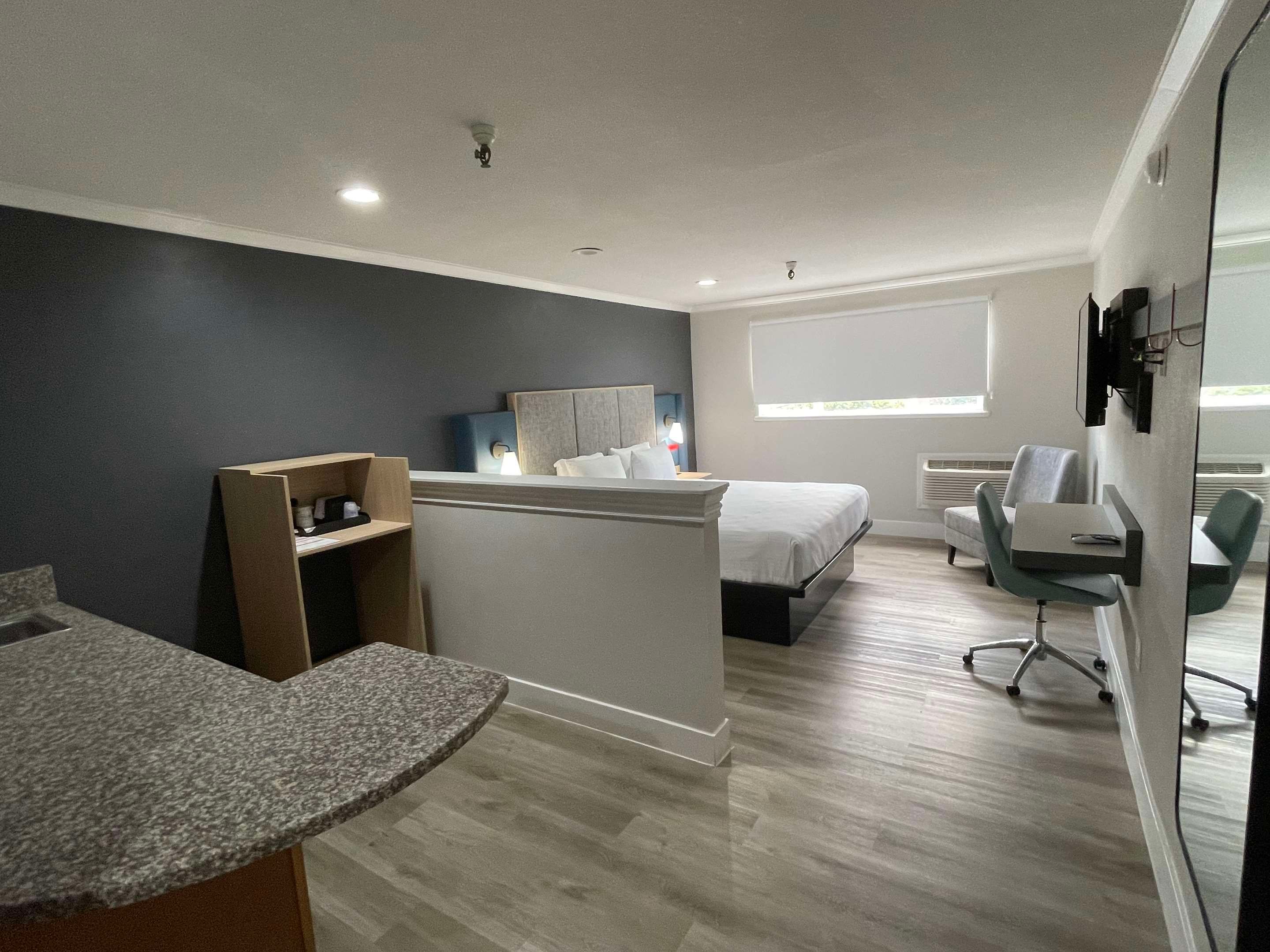 Bedroom view of The Midtowner Hotel, SureStay Collection by Best Western