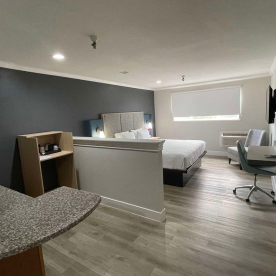 Bedroom view of The Midtowner Hotel, SureStay Collection by Best Western